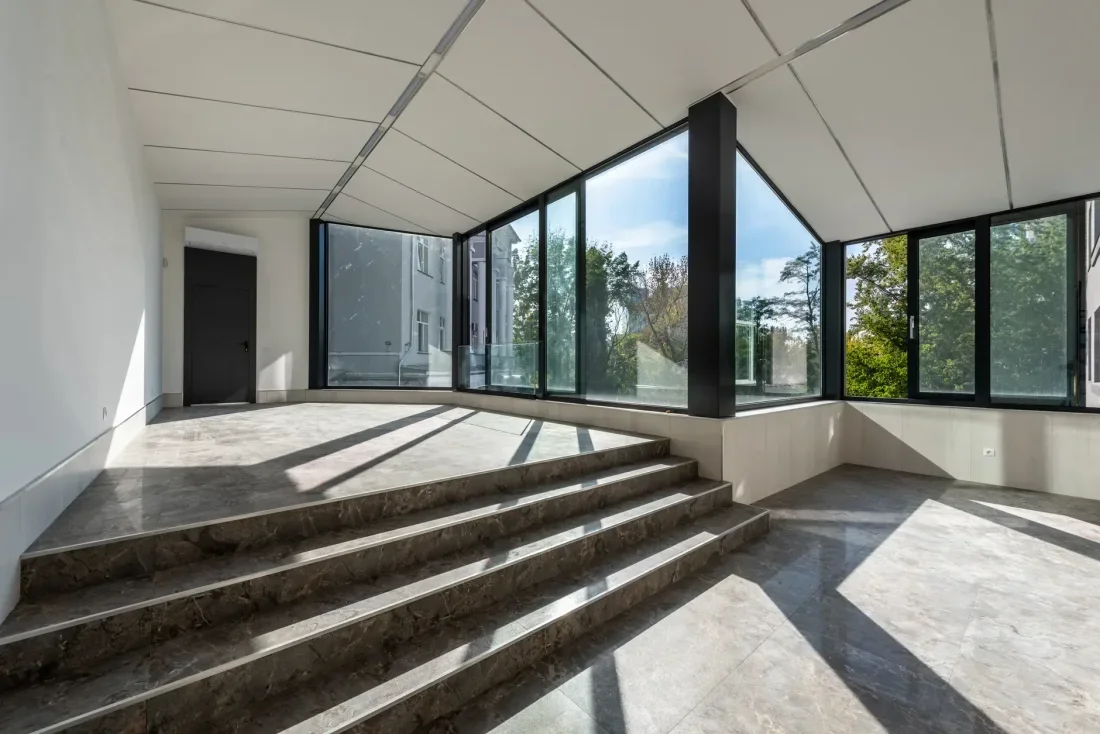 A bright living space shaped by natural textures and daylight.