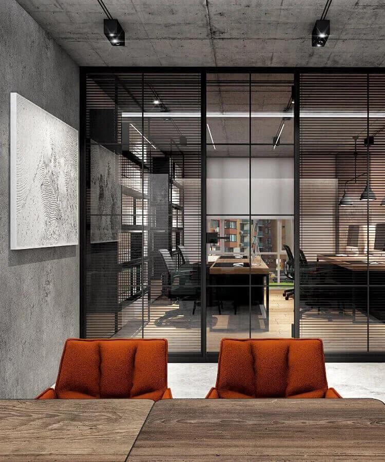 An office design that balances communication and focus through glass partitions and open work areas.